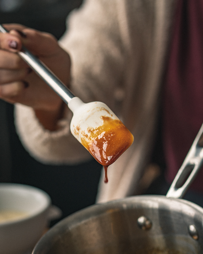 pomegranate molasses coating the back of a spatula