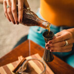 pouring homemade allspice dram